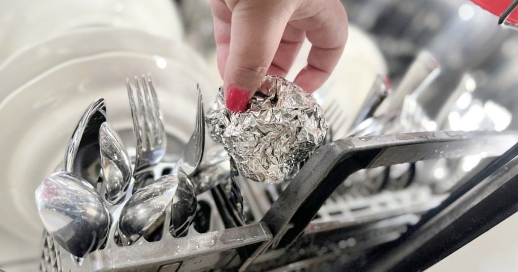 Why use aluminum foil in the dishwasher, and what are the results?