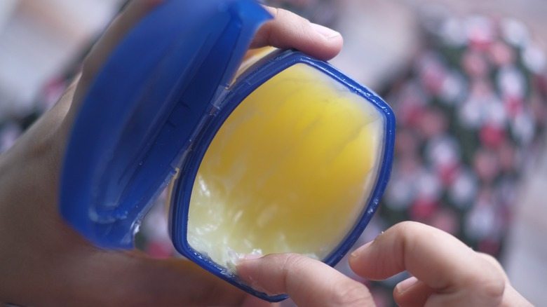 Put vaseline on the base of your light bulb